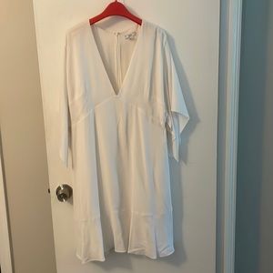 Lewit white dress with deep v neck size 12. Worn once. Dry cleaned.